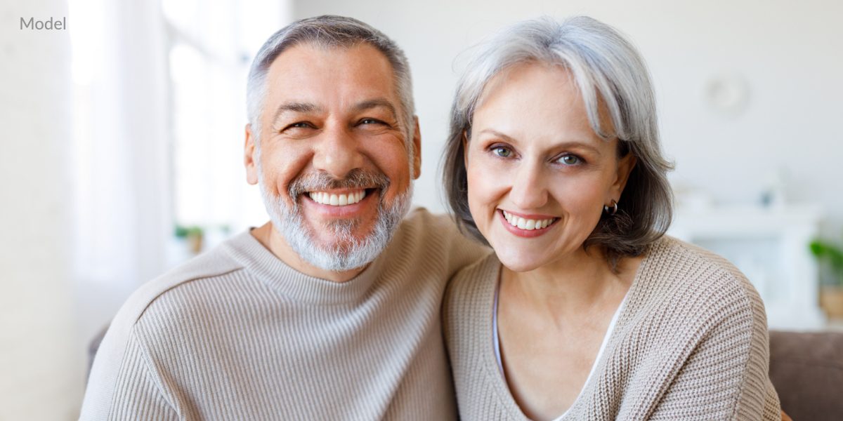 K Page Dental Implants Procedure page | Mercer Island Oral Maxillofacial Surgery Smiling models demonstrate the potential results of dental implants